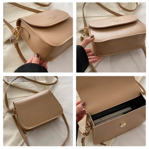 Detail view of khaki PU leather saddle bag with interior phone pocket and strap