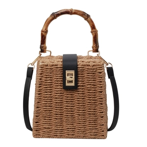 Retro woven straw handbag with bamboo top handle and gold turn-lock closure