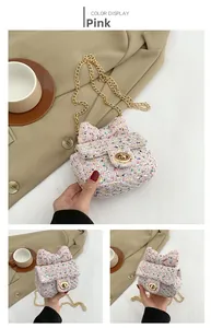 Detailed view of a pink tweed crossbody bag with a large bow and gold chain strap