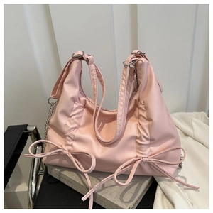 Pink PU leather tote with ruched texture, soft pleats and decorative bows detail