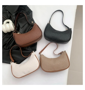 Close-up of hobo bags in four colors showing woven texture and zipper details