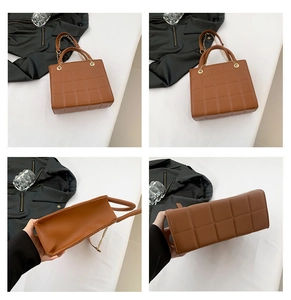 Detail view of brown quilted bag with gold chain and refined checkered stitching pattern