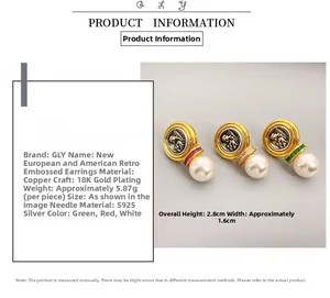 Detailed view of French vintage embossed earrings featuring pearls and 18K gold plating