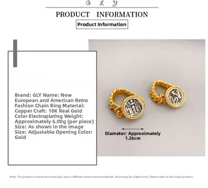 Detail of 18K gold-plated copper rings featuring coin relief and chain link design