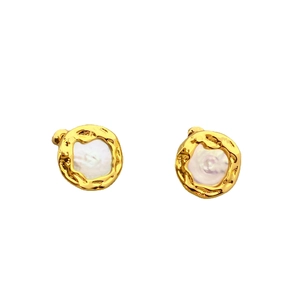 Minimalist gold hammer-textured stud earrings with round white baroque pearls on white backdrop
