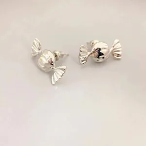 Polished silver candy-shaped stud earrings in a minimalist and trendy metal design