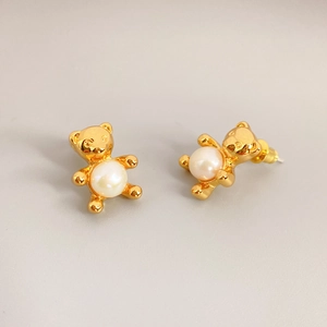 Chic gold bear stud earrings with white pearls for women in a minimalist fashion style