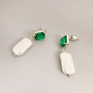 Pastoral freshwater pearl drop earrings with emerald cut green stone and silver base