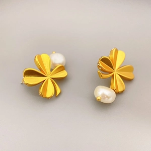 Elegant gold four-leaf clover stud earrings with fresh water pearls and crystal accents