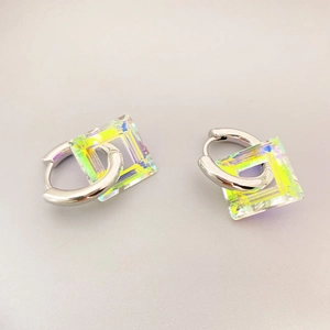 Silver hoop earrings with square iridescent resin charms on a clean grey background