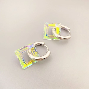 Silver hoops with iridescent resin cube pendants featuring colorful rainbow glow
