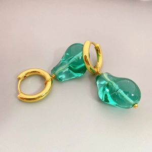 Fashionable gold hoop earrings featuring detachable organic green glazed glass pendants
