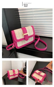 Detail of woven straw handbag with fuchsia faux leather trim and gold metal buckle