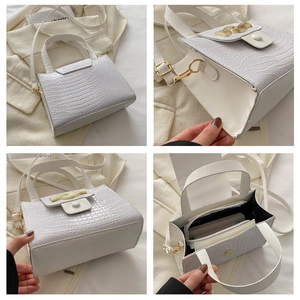 Détails du sac blanc à motif crocodile avec boucle dorée et compartiments intérieurs