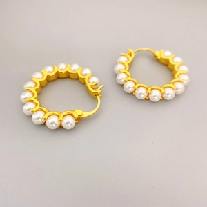 Elegant gold-tone hoop earrings with a full circle of white pearls for summer style