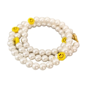 Elegant pearl choker necklace featuring yellow smiley face beads and gold lobster clasp