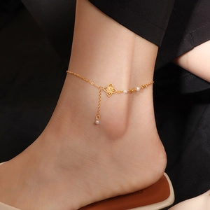 Luxurious gold flower anklet with elegant white pearls and fringe tassels for women