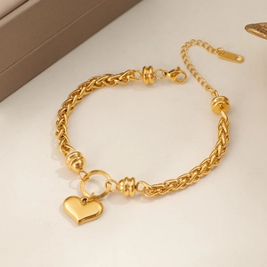 Elegant gold heart pendant bracelet with polished finish and lobster clasp for women