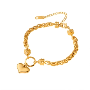 Elegant gold heart pendant bracelet with braided chain and adjustable lobster clasp closure