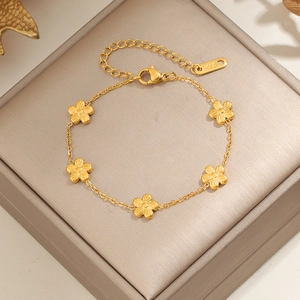 Elegant 18K gold plated flower bracelet featuring five petal charms on a velvet box