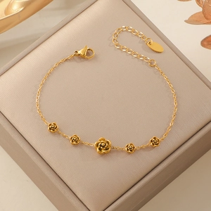 Exquisite gold stainless steel bracelet with five detailed 3D camellia flower charms