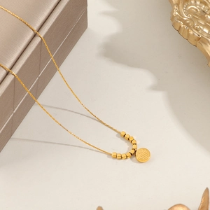 Elegant 18K gold-plated necklace with Fu character pendant and small cubes on gold chain