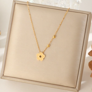 Elegant gold titanium steel necklace featuring a delicate peach blossom flower pendant