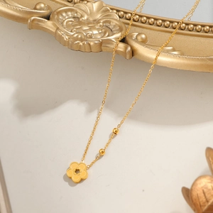 Titanium gold peach blossom necklace featuring a delicate hollow flower pendant and O-chain