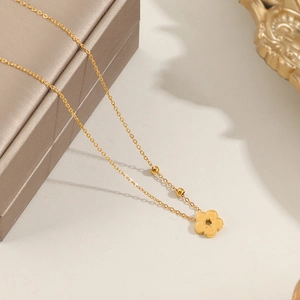 Exquisite gold floral necklace with hollow peach blossom pendant and delicate bead accents