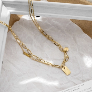 Golden double layer queen portrait necklace with square nameplate and beaded chain