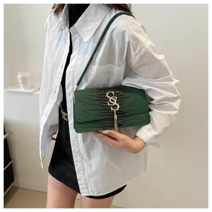 Dark green croc-embossed small square bag with gold logo and tassel charm for women
