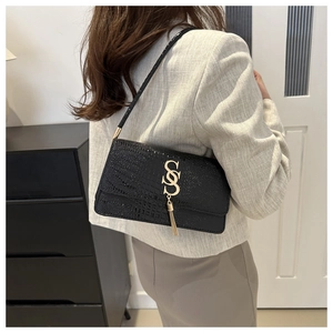 Elegant black crocodile pattern shoulder bag with gold metal tassel and S-logo for women