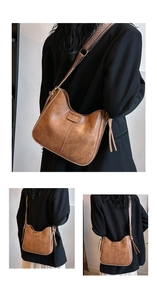 Detailansicht der braunen Vintage-Ledertasche mit geometrisch gewebtem Schultergurt