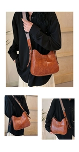 Detail der braunen Vintage-Schultertasche mit buntem gewebtem breitem Gurt