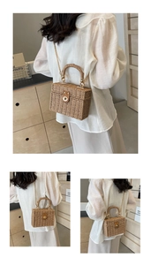 Detailed views of women woven straw handbag with gold hardware and chain strap