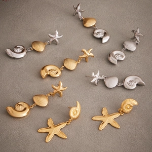 Gold and silver stainless steel ocean earrings featuring starfish and seashell designs