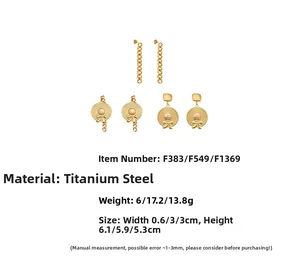 Detail view of 18k gold plated titanium steel earrings with bow and hat pendant designs