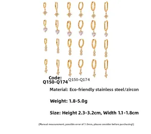 Detail of 18k gold plated stainless steel hoop earrings with zircon heart and star charms
