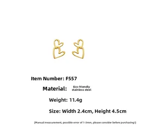 Detail showing 18k gold plated double heart earrings with 2.4x4.5cm dimensions