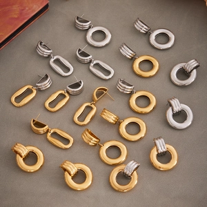Minimalist irregular hollow hoop earrings set in 18k gold and silver polished finish