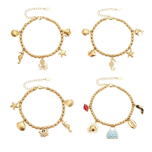 Golden stainless steel ocean bracelets with starfish and octopus charms set of four