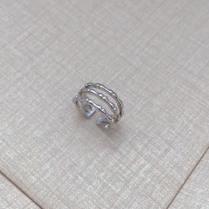 Modern silver three-layer bamboo joint open ring with a textured geometric design