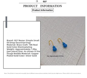 Detailed view of blue enamel gourd earrings made of 18K gold plated brass with size data