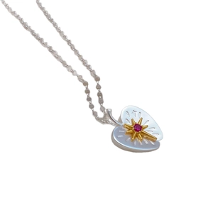 Chic two-tone apple pendant necklace with red gemstone and golden star starburst accent