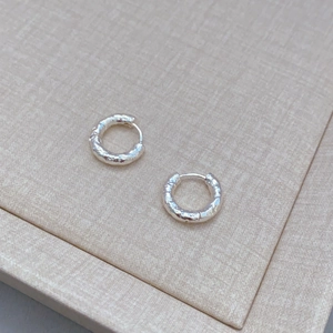 Modern silver earrings with hammered texture and hoop design for stylish daily wear