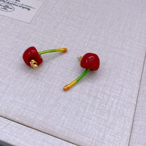 Elegant cherry shaped stud earrings with red glossy fruit and golden metal stems