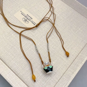 Retro colorful enamel jar pendant necklace with brown braided cord and bead accents
