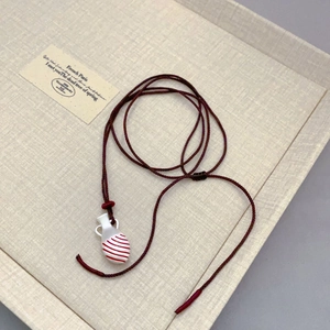 Retro colorful enamel vase pendant necklace with red textured details and woven rope