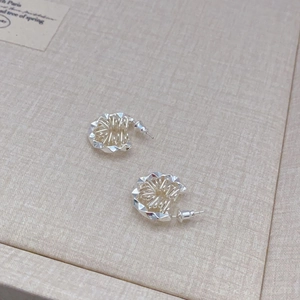 French vintage silver gear floral stud earrings with intricate brushed metal texture