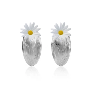 Silver retro oval textured earrings with white daisy flower accents on white background